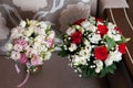 bouqets with red, white, pink roses, green leaves and ribbon