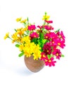 A bouquet of artificial flowers in a clay jug Royalty Free Stock Photo