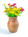 A bouquet of artificial flowers in a clay jug Royalty Free Stock Photo