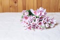 Bouquet of artificial flowers. Gentle colors. Light background