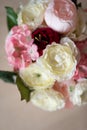 Bouquet of artificial peonies close-up. All shades of pink