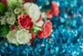 Bouquet of artificial rose flowers on blue background. Close up Royalty Free Stock Photo