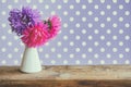 Bouquet aster flowers on wooden table