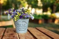 Bouquet of autumn flowers in vintage vase on wooden table in garden. Home decor in rustic style. Mother`s Day. Fresh Field summer Royalty Free Stock Photo