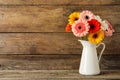 Bouquet of beautiful colorful gerbera flowers in vase on wooden table. Space for text Royalty Free Stock Photo