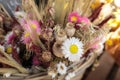 Bouquet of beautiful dried flowers plants - white and pink chrysanthemums, poppies, wheat spikelets in the greek flowers bar.