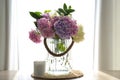 Bouquet of hydrangea flowers on table near window. Interior design Royalty Free Stock Photo