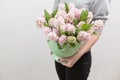 Bouquet of Beautiful pink hyacinths. Spring flowers in vase in woman hand. bulbous plant. Horizontal photo Royalty Free Stock Photo