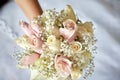 Bouquet of the beautiful pink and white wedding roses with a diamond ring Royalty Free Stock Photo