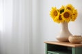 Bouquet of beautiful sunflowers and wicker basket on table indoors. Space for text Royalty Free Stock Photo