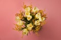 Bouquet with beautiful tulips and mimosa flowers on pink background, top view Royalty Free Stock Photo