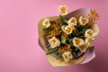 Bouquet with beautiful tulips and mimosa flowers on pink background, top view. Space for text Royalty Free Stock Photo