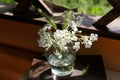 Bouquet of beautiful wildflowers in glass vase on book, closeup Royalty Free Stock Photo