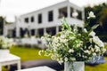 Bouquet of blooming White Gypsophilla flowers known as baby breath in white glass vase with Bride`s Veil. Large free space left Royalty Free Stock Photo