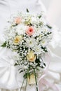 Bouquet of the bride from creamy roses