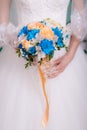 Bouquet of the bride in the hands of wedding rings. the bride is holding a bouquet. Royalty Free Stock Photo
