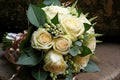 bouquet for bridesmaids and bridesmaids with cream roses and lots of green leaves Royalty Free Stock Photo