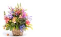 Bouquet of bright flowers in basket isolated on white background.Copy Space. . Mothers Day or Valentines Day Concept Royalty Free Stock Photo