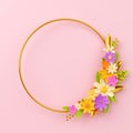 A bouquet of bright flowers on a round hoop on a pink background.