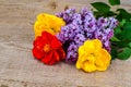 Bouquet of bright freshly cut flowers on wooden table