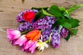 Bouquet of bright freshly cut flowers on wooden table