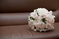 Bouquet on brown leather chair
