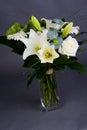 Bouquet bunch of beautiful white flowers with white roses, lily and daisy Royalty Free Stock Photo