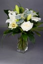 Bouquet bunch of beautiful white flowers with white roses, lily and daisy Royalty Free Stock Photo