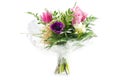 Bouquet in cellophane with pink and purple flowers, isolated on Royalty Free Stock Photo