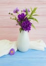 Bouquet purple chrysanthemum bell creative elegance vintage autumn mood design in a vase on a wooden background Royalty Free Stock Photo