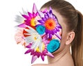 Bouquet of colorful flowers inside young woman`s face.