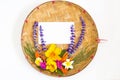 Bouquet of colorful flowers on threshing basket