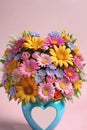 Bouquet of colorful flowers in a vase with a heart.