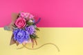 A bouquet of colorful paper flowers on magenta and yellow backgrounds as a backdrop for a postcard, invitation letter and etc Royalty Free Stock Photo