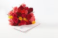 Bouquet of colorful roses and letter in an envelope on white background.Congratulations on holiday.Copy space. Isolated Royalty Free Stock Photo