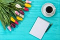 Spring background!A bouquet colorful tulips and an empty notebook for romantic entries