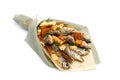 Bouquet consisting of salted stockfish of different breeds, slices of dried squid and other fish lies on a white surface Royalty Free Stock Photo