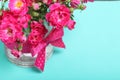 Bouquet of crimson roses in a glass vase with a bow. Royalty Free Stock Photo