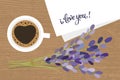 Bouquet and a cup of coffee. Lavender flowers and a cup of coffee. Coffee and a note i love you. Royalty Free Stock Photo