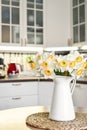 Bouquet of daffodils in interior of the kitchen Royalty Free Stock Photo