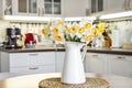 Bouquet of daffodils in interior of the kitchen Royalty Free Stock Photo
