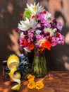 Bouquet with dahlias, phlox, nasturtium, gomphrena, eucomis, grapes and lemon
