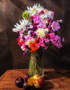 Bouquet with dahlias, phlox, nasturtium, gomphrena, eucomis, plums and apples