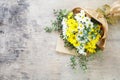 Bouquet daisy chamomile flowers on wooden garden table.