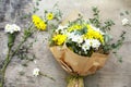 Bouquet daisy chamomile flowers on wooden garden table.