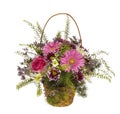 Bouquet of decorative bright colorful flowers in a wicker basket Royalty Free Stock Photo