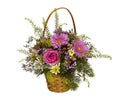 Bouquet of decorative bright colorful flowers in a wicker basket on a white background Royalty Free Stock Photo