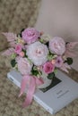 A bouquet of delicate flowers for a girl on mother's day, valentine's day in a light ceramic pot stand on a Royalty Free Stock Photo