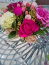 A bouquet of delicate roses of three colors with green twigs Royalty Free Stock Photo