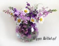 Bouquet of delphinium, chamomile and daylily. Flowers in a bouquet of country style in a glass vase. Royalty Free Stock Photo